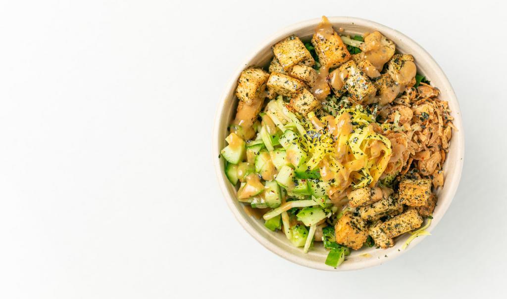 Japanese Bowl · Sesame miso sauce, topped with cucumber, roasted seaweed, tofu croutons, green onions, furikake, crispy fried onion and pickled ginger garnish. Vegan. Dairy free.