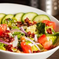 Cobb Salad · Romaine, cucumber, tomato, bacon, red onions, gorgonzola crumbles, hard boiled egg and choic...