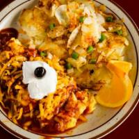 Enchilada Omelette · Shredded beef, onions, bell peppers and enchilada sauce with Jack & Cheddar cheese. Garnishe...