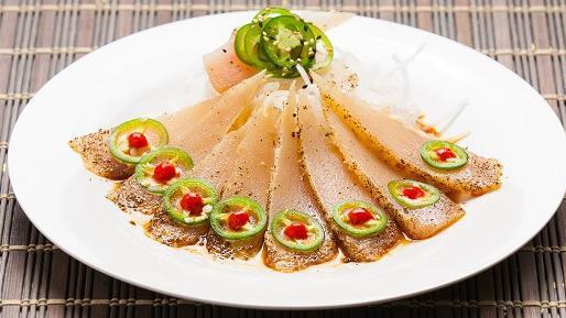 Pepper Fin · Slices of seared albacore with ponzu sauce, topped with jalapenos and spicy sauce.