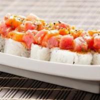 Yuri · Crabmeat, cucumber, topped with diced tuna, salmon, and albacore mixed with chopped lemon an...