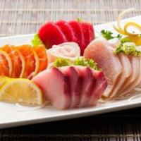 Deluxe Combo Sashimi · Served with soup and rice. Chef's choice of 18 Pc assorted sashimi.