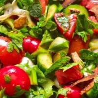 Fattoush · Fresh romaine lettuce, chopped parsley, onions, cucumbers, tomatoes, radish and sumac tossed...