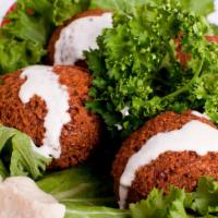 Falafel Plate · Five pieces of gluten free falafel made from garbanzo beans, served with hummus, salad, tahi...
