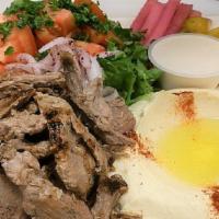 Tri-Tip Shawerma · Marinated USDA choice tri-tip steak, cooked on vertical broiler then thinly sliced, served w...