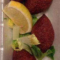 Kibbeh Ball · Ground beef mixed with seasoned cracked wheat, stuffed with top serloin, onion, pine nuts an...