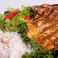 Boneless Trout · Fresh grilled marinated boneless trout, served with hummus, rice, salad, tahini sauce, pickl...