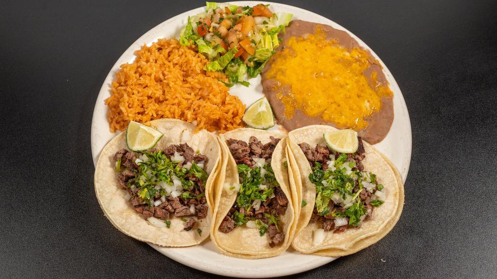 Street Tacos · Three tacos on soft corn tortillas with cilantro, onion, lime, served with pico de gallo, rice and beans, or salad.