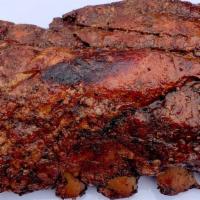 Ribs - Half Slab · Our famous ribs covered with our select BBQ sauce.