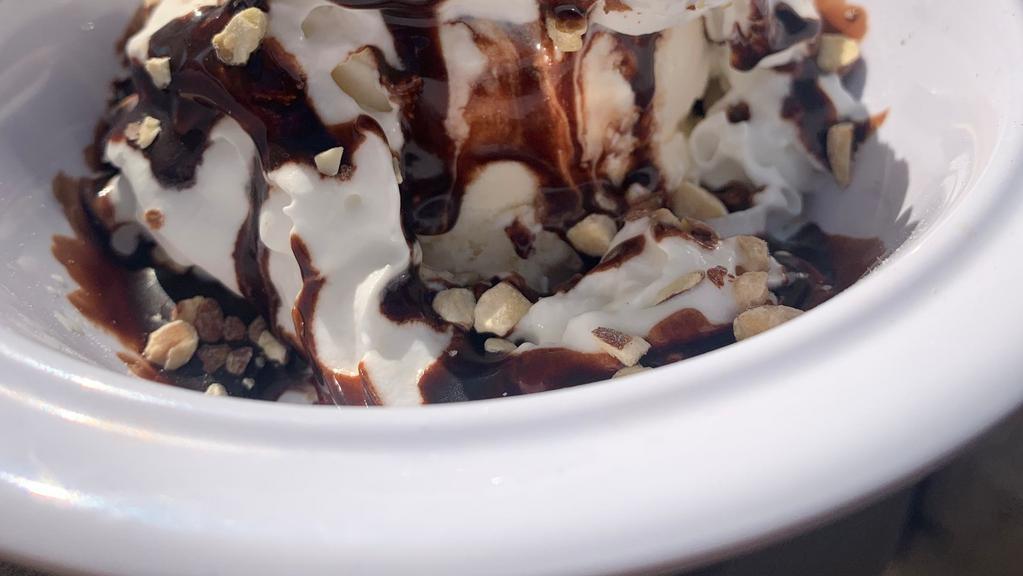 Hot Fudge Sundae · Vanilla Ice Cream covered in Chocolate Sauce, Whipped Cream, Almonds, and Topped with a Cherry.