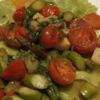 Ravioli Di Carciofi · Artichoke ravioli, cherry tomatoes, asparagus,
olive oil, garlic, white wine.