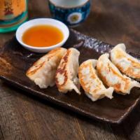 Gyoza · Pork, chicken and vegetable dumplings served fried or grilled with gyoza sauce