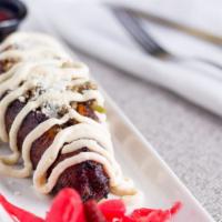 San Pedro Sula · Ripe plantain sliced down the middle and stuffed with ground beef, dry cheese, cream and Hon...
