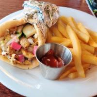 Chicken Shawarma Wrap · Hummus paste, tomatoes, onions, shredded lettuce, turnip pickles, drizzled with white and ta...