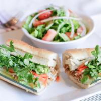 Mai Bánh Mì · Vietnamese-french baguette with shredded tofu and kelp noodles, soy pork roll, pickled daiko...