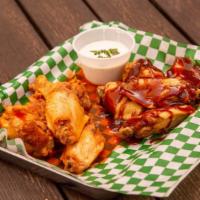 Spicy Buffalo Wings · Tender chicken wings tossed in your choice of Louisiana hot sauce or tangy BBQ.