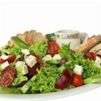 Greek Salad · Greek salad with feta cheese, cucumber, pepperoncini, olives, tomato, pita chips, and a side...