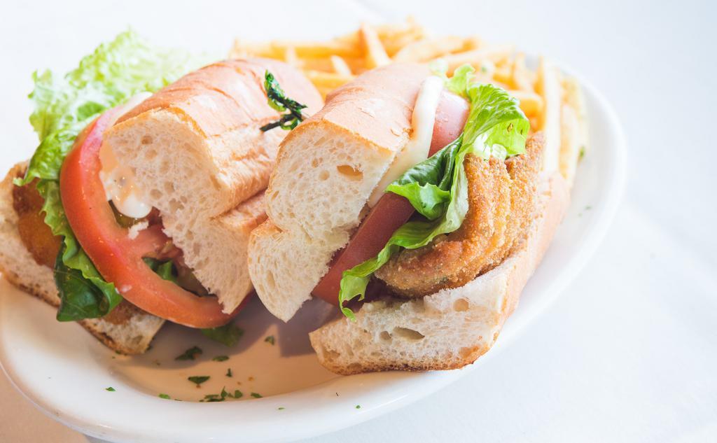 Milanesa De Pollo Sandwich · Fried breaded thin cut of chicken breast, lettuce, tomato and mayonnaise. Sandwiches served in a fresh baguette with fries 