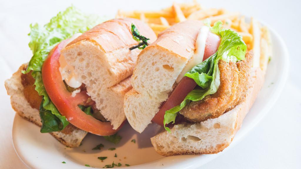 Milanesa De Carne Sandwich · Fried breaded thin cut of beef, lettuce, tomato, and mayonnaise. Sandwiches served in a fresh baguette with fries 