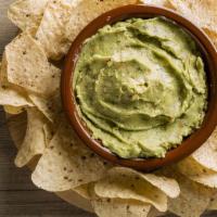 Chips & Guacamole · Fresh house made guacamole served with warm and crispy tortilla chips.