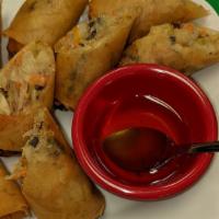 Egg Rolls · Deep fried. Stuffed mixed vegetables, glass noodles, taro wrapped in rice paper served with ...