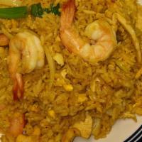 Pineapple Fried Rice · ( chicken & shrimp ) Jasmine rice, garlic, egg, onion, tomato, cucumber, curry powder, pinea...