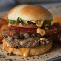 The Big Easy · Two mouthwatering, all-beef patties stacked with lettuce, tomato, bacon and pepper jack chee...