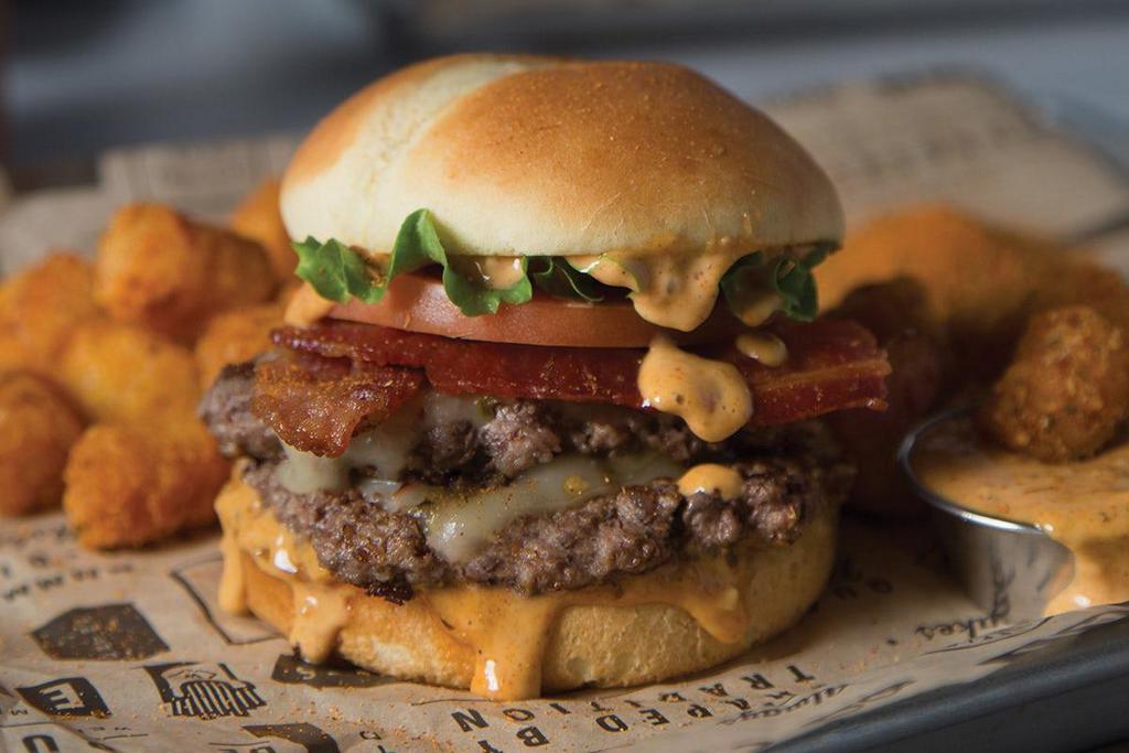 The Big Easy · Two mouthwatering, all-beef patties stacked with lettuce, tomato, bacon and pepper jack cheese—all jazzed up with a Cajun Remoulade.