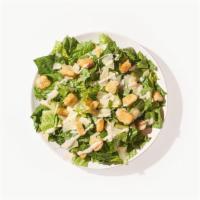Caesar Salad · Romaine lettuce, mixed field greens, shredded carrots, tomatoes, cucumbers, and Caesar dress...