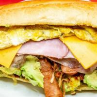 La Famous Cubana Torta · Sausage, chorizo, pulled pork, breaded steak, head pork cheese, ham, yellow cheese, two scra...