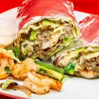 Surf & Turf Burrito · Butter grilled shrimp steak with melted cheese, grilled onions, jalapenos, lettuce, cilantro...