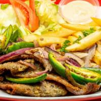 Milanesa Plate · Breaded steak or chicken refried beans, rice, salad, torillas, grilled onion & jalapeno.