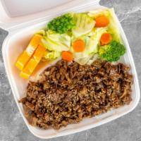 Beef Plate · Serving white rice marinated sauce beef and side of a salad plate. now steam vegetable avail...