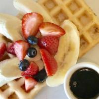 Gluten-Free Waffle · Topped w/ mixed berries, banana, nuts, organic maple syrup.