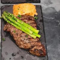 Ribeye Stk  · 8-10 oz ribeye with loaded potatoes and bacon wrapped asparagus