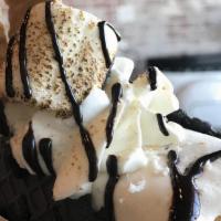S'Mores Galore · Graham cracker ice cream, topped with whipped cream, graham cracker, toasted marshmallow, ch...