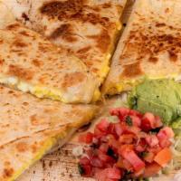 Breakfast Quesadilla · Flour tortilla, mozzarella cheese & scrambled eggs, with your choice of salsa on the side an...