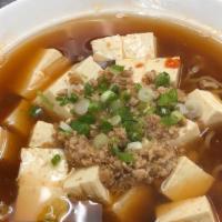 Mabo Tofu Ramen · Soy sauce based chicken broth, topped with spicy ground pork, tofu, and green onions.