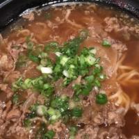 Niku Ramen  · Soy sauce based chicken broth, topped with thinly sliced beef and onions.