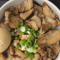 Chashu Don · Slices of chashu  pork ,  soft boiled egg and green onions over rice drizzled with soy sauce...