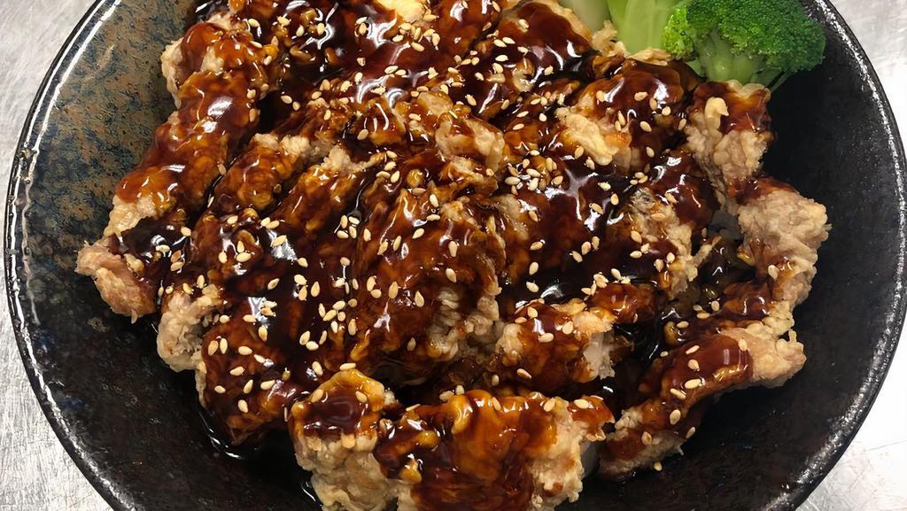 Sesame Chicken Don · Bowl of rice, topped with batter-fried chicken, drizzled with house teriyaki sauce, sesame seeds, and steamed broccoli.