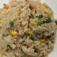Chicken Fried Rice · Stir-fried rice with pieces of chicken, carrot, peas and green onions.