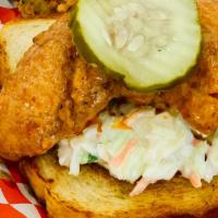 #2 Chicken Tender · Chicken Tender served over a slice of white bread with coleslaw and pickle