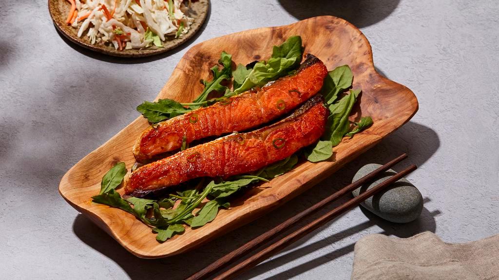 Salmon Plate · Salmon with housemade teriyaki sauce, your choice of a base and house salad.