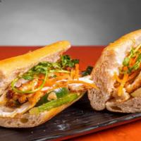 Veggie Banh Mi · Freshly baked baguette with egg, house spread, cucumber, jalapeño, pickled carrot, cilantro,...
