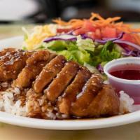 Sesame Chicken Dish · Baked and breaded chicken breast drizzled with our homemade teriyaki sauce over rice, & serv...