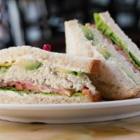 Sunshine Sandwich · Our signature sandwich. A scoop of our chicken salad, avocado, lettuce, sliced tomato, onion...