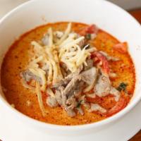 Red Curry · Red curry in coconut milk, sweet basil, bamboo shoot and red bell pepper.