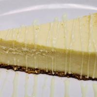Cheesecake Classic Slice  · A dielicious cinnamon , graham cracker crust filled with classic , creamy and smooth cream c...