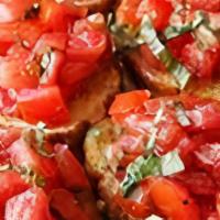 Bruschetta · Chopped fresh Roma tomatoes with garlic, basil, olive oil, fresh ground pepper and vinegar. ...